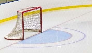 A hockey net on a rink. © Can Stock Photo / ClickImages