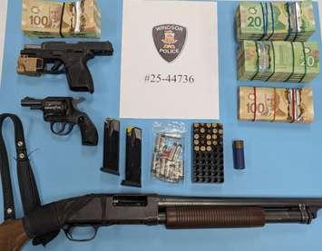 Weapons and cash seized in a raid by Windsor police on May 8, 2025. Photo courtesy Windsor police.