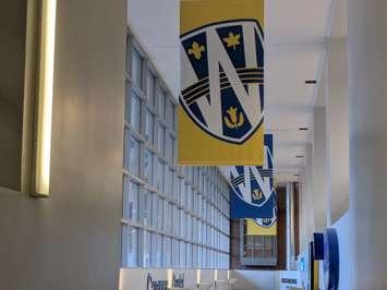 Banners hang at the University of Windsor's CAW Student Centre, February 10, 2025. Photo by Mark Brown/WindsorNewsToday.ca.