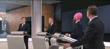 Liberal Party Leader Mark Carney, second from left, speaks while Conservative Leader Pierre Poilievre, from left, NDP Leader Jagmeet Singh, and Bloc Quebecois Leader Yves-Francois Blanchet listen during the English leaders' debate in Montreal, April 17, 2025. Screenshot courtesy CPAC/YouTube.